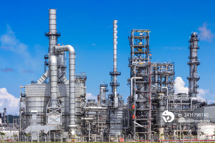 Petrochemical plant, oil refinery factory with cloudy sky