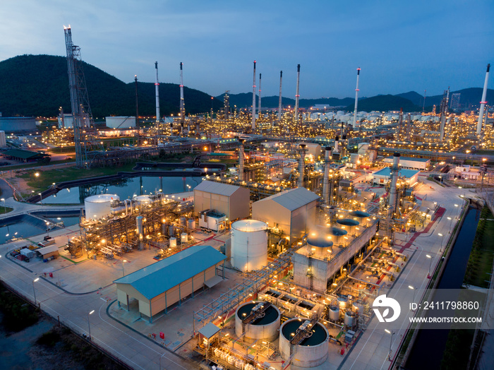 Aerial view of chemical oil refinery plant, power plant at sunset sky for industry concept.