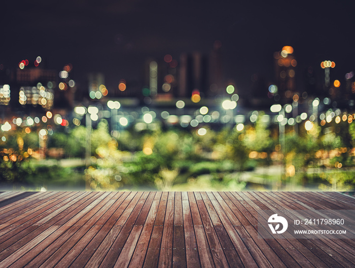 wooden table blurred sky night city building