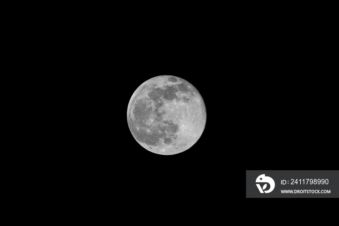 Closeup moon on night sky. Full moon lunar phase isolated on black background for overlays