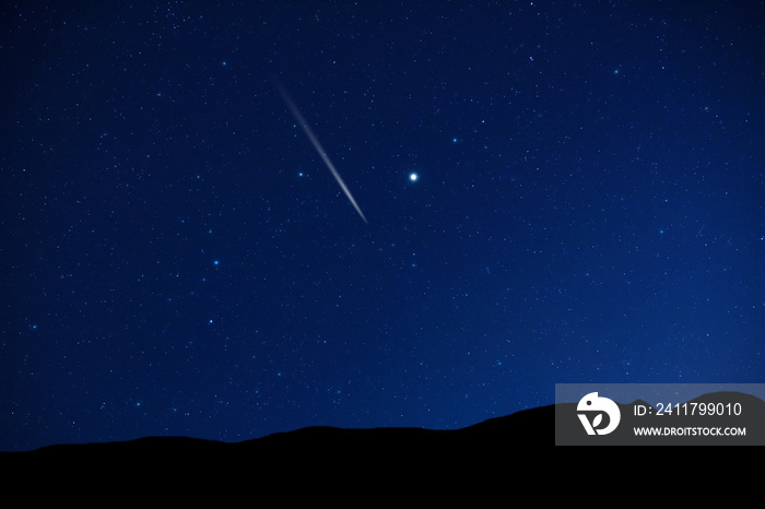 Starry Milky Way skies with comet and meteor shower, falling and shooting stars.