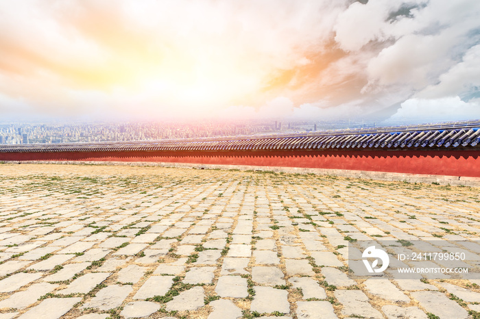 Square brick and red wall with modern city skyline