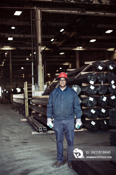 Portrait of worker standing in factory