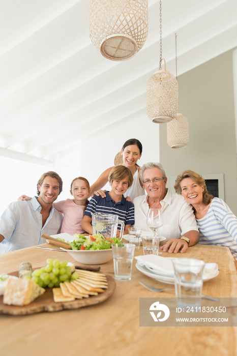 Portrait happy multi-generation family enjoying lunch at table