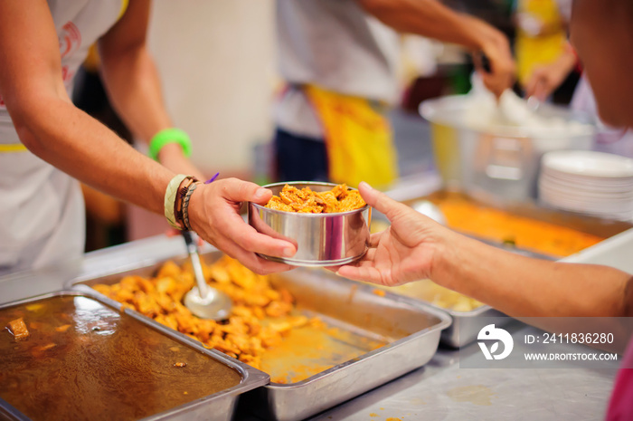 Volunteers donate food to help homeless and hungry people.