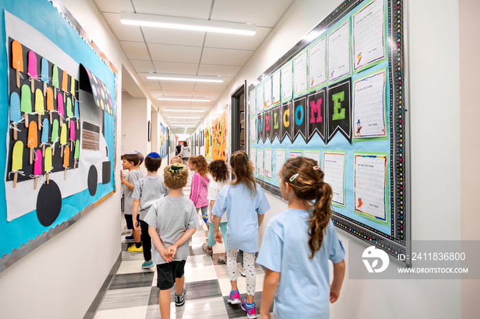 Students walking in school hallway