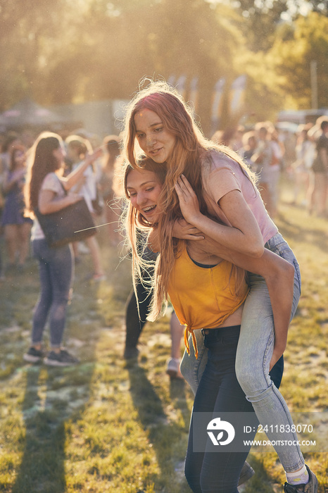 Portrait of happy young girls on holi color festival