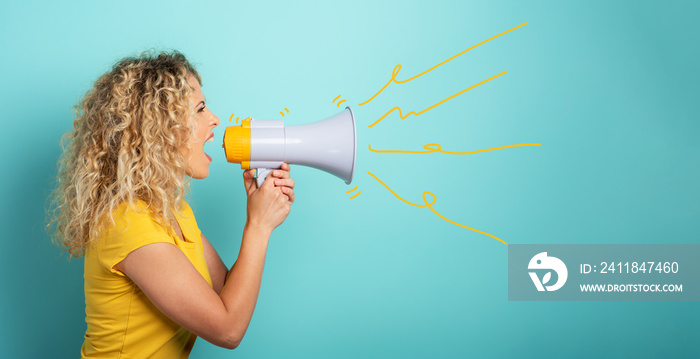 Woman screams with loudspeaker. angry expression. cyan background