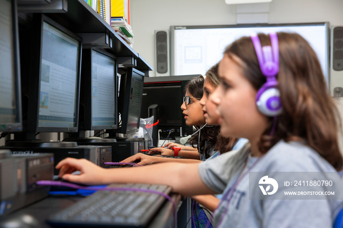 Children using computer in a classroom