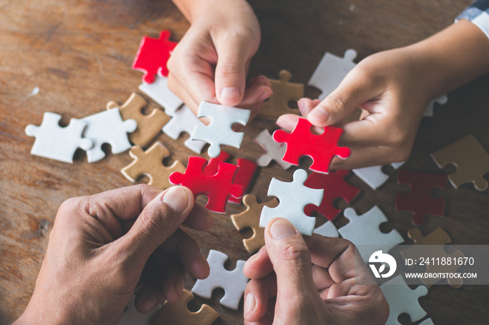 Business people Holding Jigsaw Puzzle, group of business people using a jigsaw puzzle to demonstrate