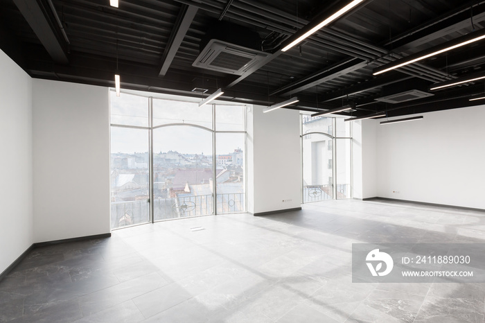 Interior photography, large spacious office center, with panoramic windows and unfurnished glass doo