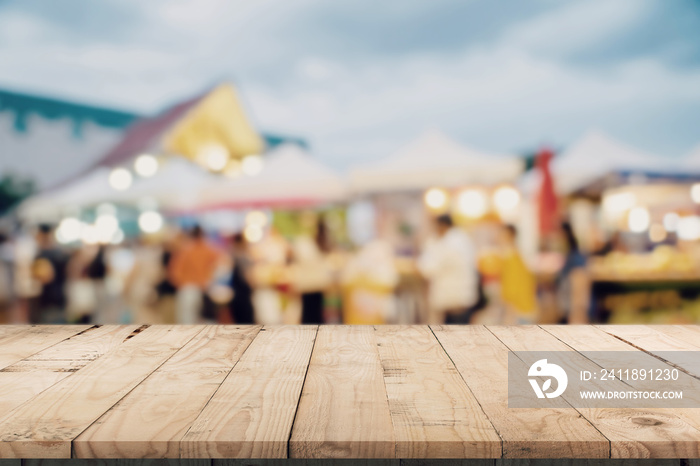 Empty wood table and Vintage tone blurred defocused of crowd people in walking street festival and s