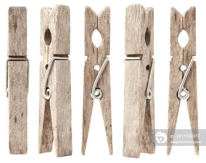 Old wood clothespins on isolated white background