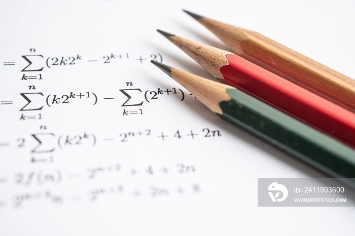 Pencil on mathematic formula exercise test paper in education school.