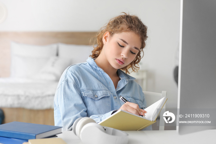 Female student studying online at home