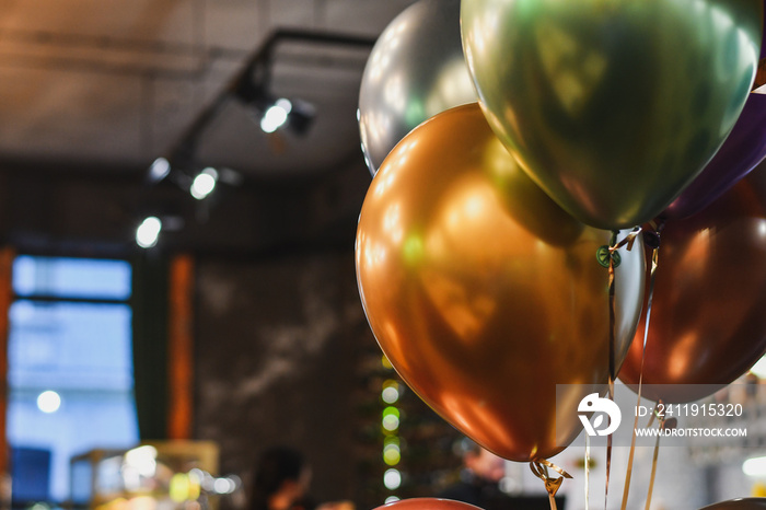 Close up of festive helium baloons on birthday celebration. Selective focus.