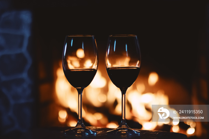 Red wine in front of a fireplace, relaxing atmosphere