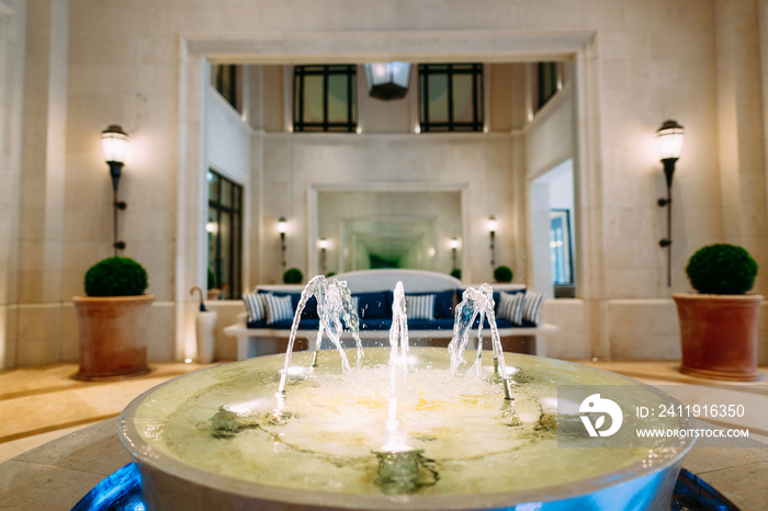 Fountain in the lobby of the Regent Hotel in Tivat, Montenegro. Decorative fountain bowl for indoor 