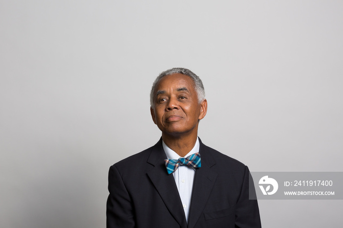 studio portrait of a thoughtful businessman