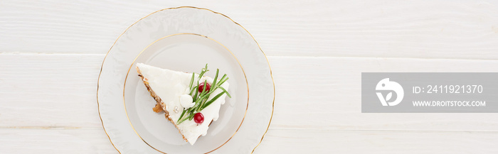 top view of piece of christmas pie on plate on white wooden table