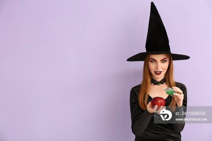 Young witch with apple and potion on color background