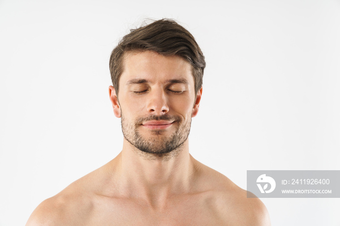 Close up of a handsome young shirtless man isolated