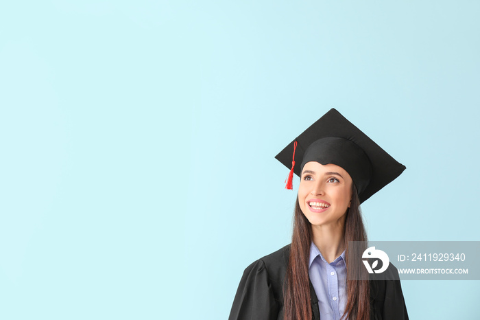 Female graduate on color background