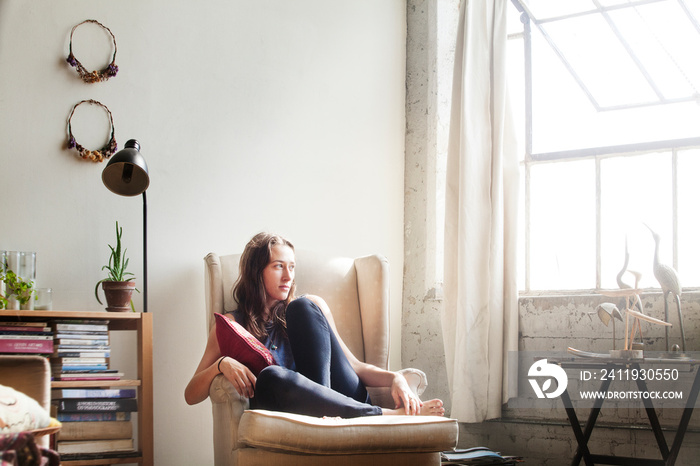 Young woman sitting in chair