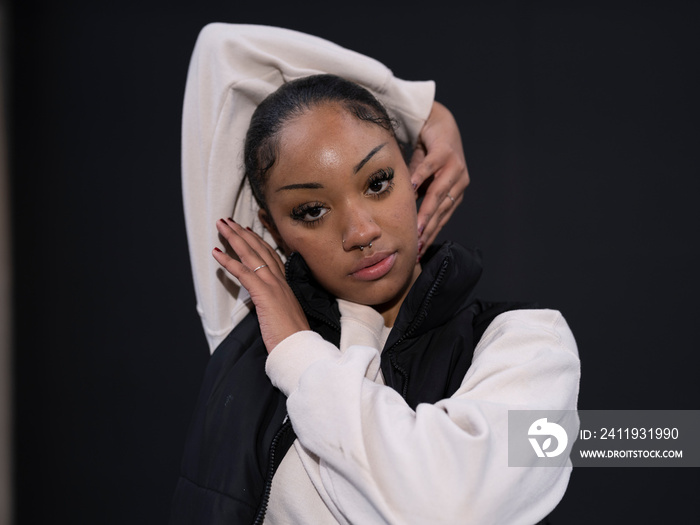 Portrait of teenage girl in sports clothing in city