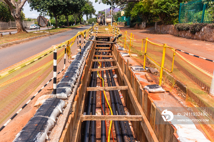 Electricity New Power Cables Installation trenches underground road side.