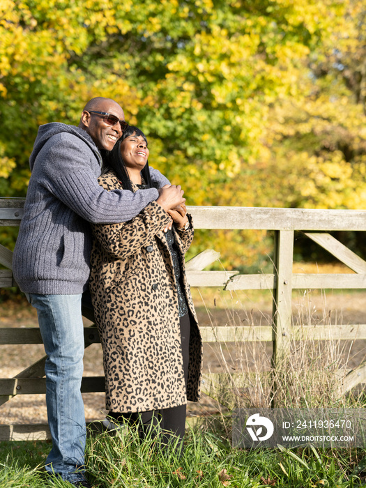 Portrait of senior couple embracing in nature