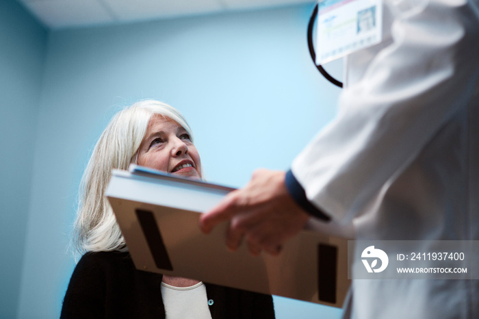 Doctor talking to senior patient