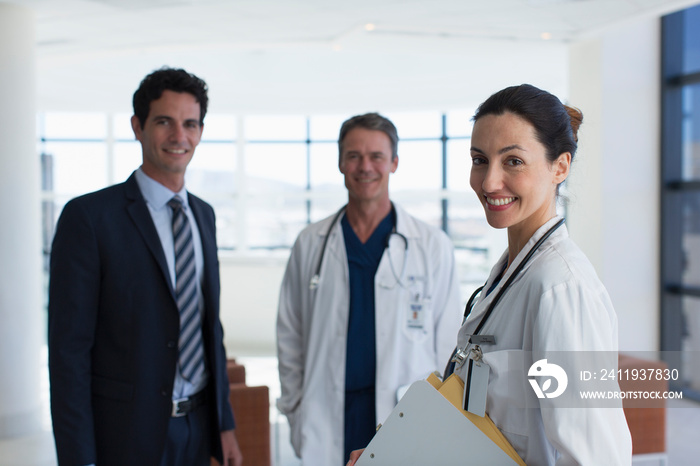 Portrait confident doctors and hospital administrator in lobby