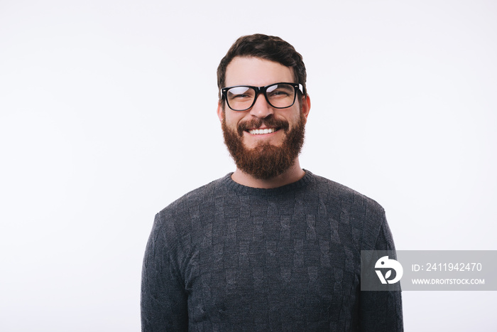 Portrait of young handsome man wearing eyeglasses smiling and looking confident at the camera