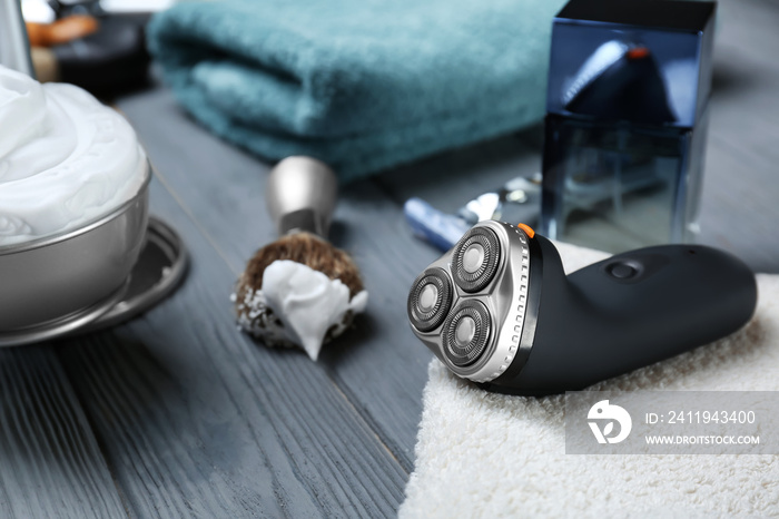 Electric shaver for man on wooden table