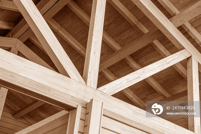 The construction of the wooden roof. Detailed photo of a wooden roof overlap construction.