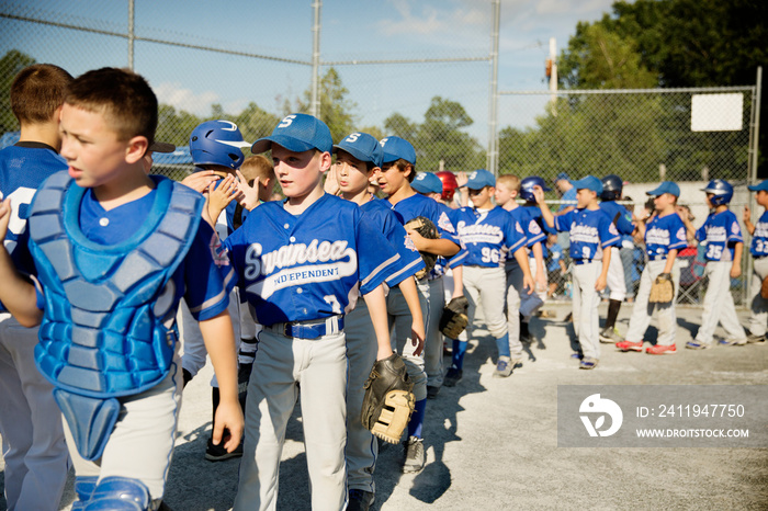 Baseball players congratulating after game