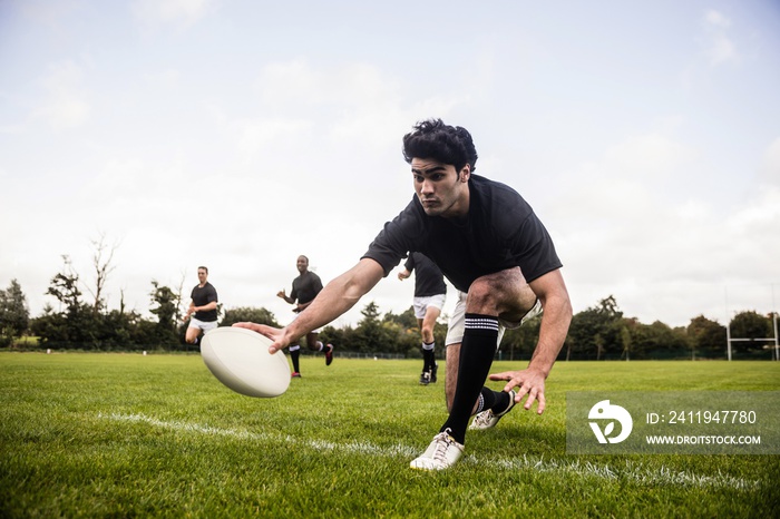 Rugby players training on pitch