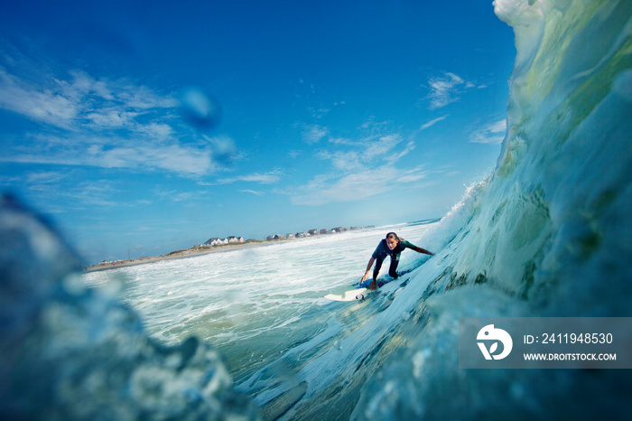 Woman surfing in sea