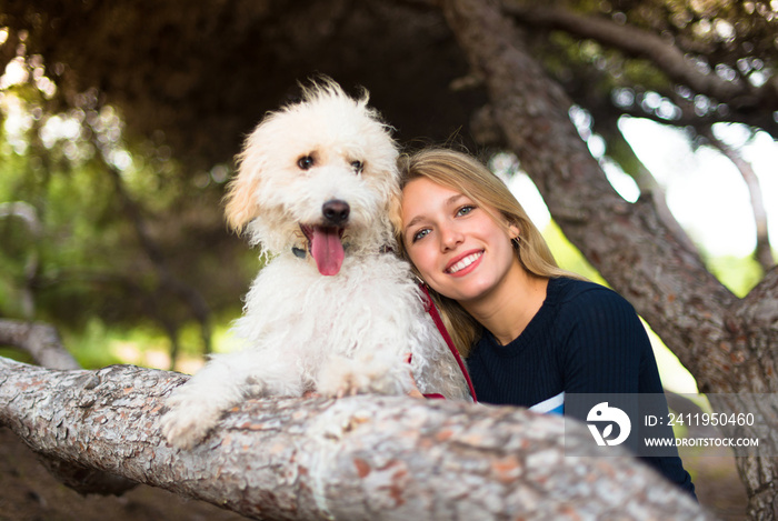 Young girl with her dog in a park