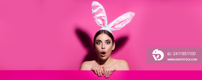 Easter banner with bunny woman. Funny emotions, excited expressing. Bunny woman isolated on pink.