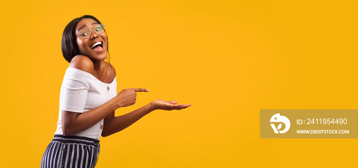 Girl Pointing Finger At Open Palm Standing, Studio Shot, Panorama