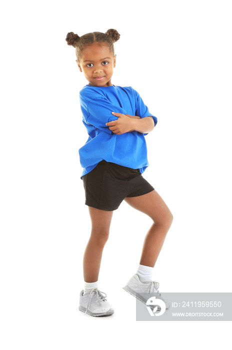 Cute little sportive girl posing on white background