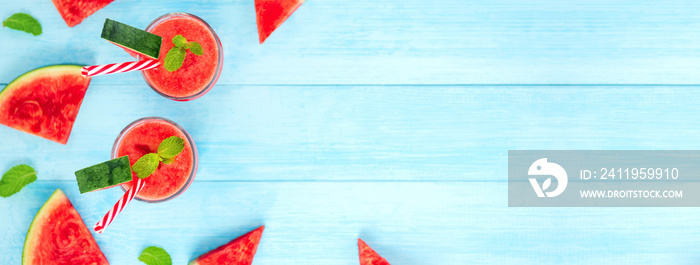 Watermelon juice smoothies in the glasses on light blue wood background