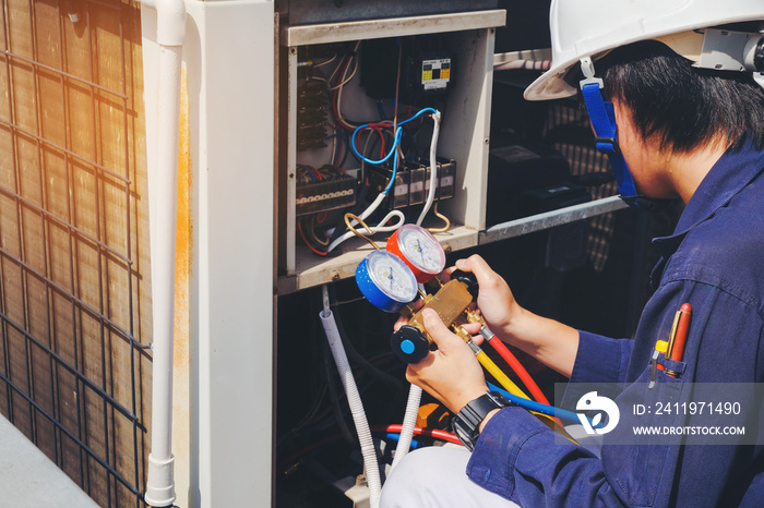 Technician is checking air conditioner