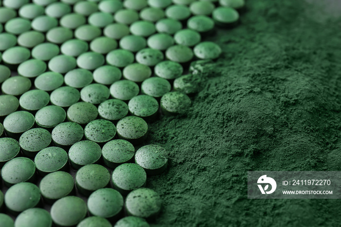 Spirulina tablets with powder, closeup