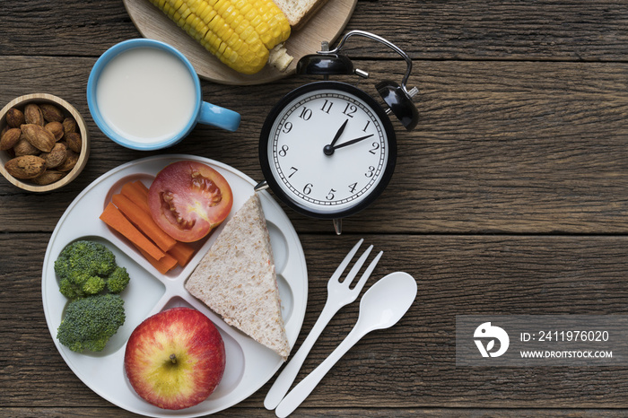 Meal time with alarm clock at lunch time