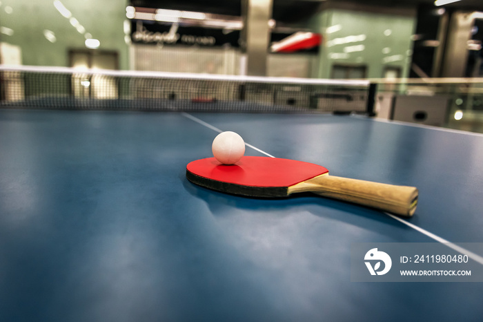 tennis racket and ball on the table