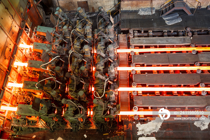 hot steel on conveyor in steel mill