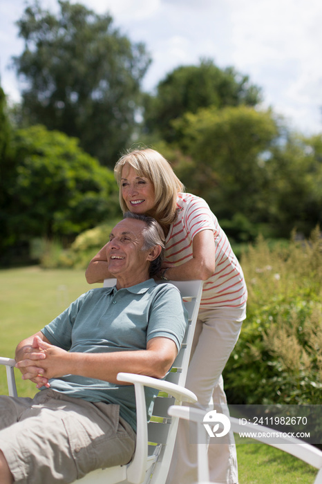 Happy senior couple in sunny garden